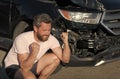 frustrated man driver at broken car after automobile collision car accident, car insurance Royalty Free Stock Photo