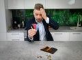 Frustrated man in heavy credit card debt Royalty Free Stock Photo