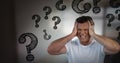 frustrated man with question marks Royalty Free Stock Photo