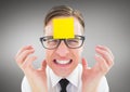 Frustrated man with sticky note on his forehead Royalty Free Stock Photo
