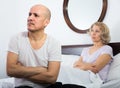 Mature couple having quarrel in bedroom. Royalty Free Stock Photo