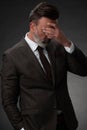 Frustrated middle aged elegant man Close up face of stressed businessman wearing stylish suit with eyes closed Royalty Free Stock Photo