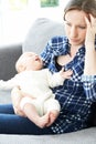 Frustrated Mother Suffering From Post Natal Depression Royalty Free Stock Photo