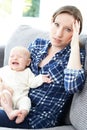 Frustrated Mother Suffering From Post Natal Depression Royalty Free Stock Photo