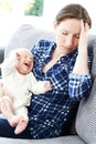 Frustrated Mother Suffering From Post Natal Depression Royalty Free Stock Photo
