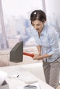 Frustrated office worker smashing keyboard Royalty Free Stock Photo