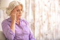 Frustrated old lady has pain in head Royalty Free Stock Photo