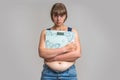 Frustrated overweight woman with scales