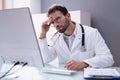 Frustrated Overworked Doctor In Hospital Looking