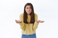 Frustrated and pissed-off angry tensed young woman cursing for bad luck or failure, shrugging with hands spread sideways