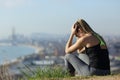 Frustrated runner sitting outdoors complaining Royalty Free Stock Photo