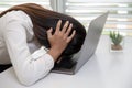 Frustrated sad woman feeling tired worried about problem  with  business, Business woman stressed from working on a laptop, The Royalty Free Stock Photo