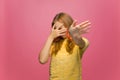 Frustrated scared young teen girl closed eyes with hands and showing stop gesture dont want to see disgraceful content Royalty Free Stock Photo