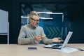 Frustrated senior gray haired businessman working in office, mature investor Royalty Free Stock Photo