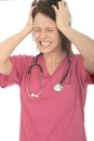 Frustrated Stressed Angry Beautiful Young Female Doctor Pulling Her Hair Royalty Free Stock Photo