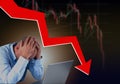 Frustrated stressed failed business man sitting with laptop with financial market chart graphic going down. Poor economy concept. Royalty Free Stock Photo