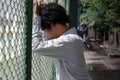 Frustrated stressed young Asian business man feeling disappointed at outside office. Royalty Free Stock Photo