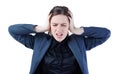 Frustrated and stressed young businesswoman in suit closed her ears isolated on white background. Royalty Free Stock Photo