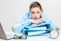 A frustrated and tired accountant with folders works Royalty Free Stock Photo