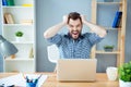 Frustrated tired man with laptop having a lot of work and screaming