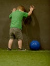 Frustrated toddler playing soccer Royalty Free Stock Photo