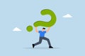 frustrated trying businessman carrying heavy burden of big question mark Royalty Free Stock Photo