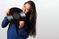 Frustrated woman biting on a vinyl record Royalty Free Stock Photo