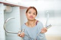 Frustrated woman having kitchen sink problem Royalty Free Stock Photo