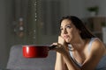 Frustrated woman looking at home water leaks