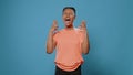 Frustrated woman screaming in front of camera in studio. Royalty Free Stock Photo