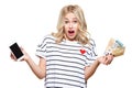 Frustrated woman shrugging shoulders, showing mobile phone with blank screen and holding loads of Euro banknotes.