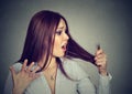 Frustrated woman surprised she is losing hair noticed split ends Royalty Free Stock Photo