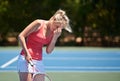 Frustrated woman, tennis and headache in mistake, fail or loser on outdoor court for game or match. Upset or Royalty Free Stock Photo