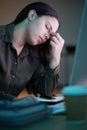 Frustrated woman, working at night in office with computer and mental health of corporate business worker. Overworked Royalty Free Stock Photo