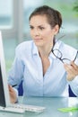 Frustrated worried young woman looks at laptop Royalty Free Stock Photo