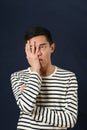 Frustrated young Asian man covering his face by palm Royalty Free Stock Photo