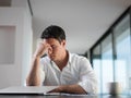 Frustrated young business man working on laptop computer at home Royalty Free Stock Photo