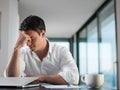 Frustrated young business man working on laptop computer at home Royalty Free Stock Photo