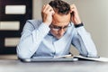 Frustrated young business man working on laptop computer at office Royalty Free Stock Photo