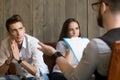 Frustrated worried young man listening to psychologist, couple c Royalty Free Stock Photo