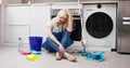 Frustrated Young Woman Sitting On Kitchen Floor Royalty Free Stock Photo