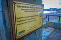 FRUTILLAR, CHILE - SEPTEMBER, 23, 2018: Close up of selective focus of informative sign of wooden pier of Frutillar