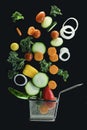 Fry basket with fresh vegetables flying in the air Royalty Free Stock Photo