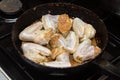 Fry chicken wings in a pan. Home cooking. Royalty Free Stock Photo