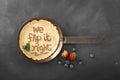 Fry pan with Fresh strawberry and blue berry on chalkboard background Royalty Free Stock Photo