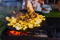 Fry potatoes on open fire in the open air