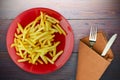 Fry potatoes on a wooden background