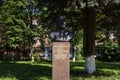 Portrait sculpture of hero of socialist labor Vladimir Vok, ex worker of Istok State Scientific Production. Sunny summer view.