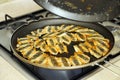 frying anchovy fish in a pan, Turkish style anchovy - pan frying, crispy fish fry Royalty Free Stock Photo