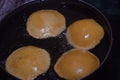 frying chapati(poori) on frying pan, boiling oil in frying pan with dark background, kitchen concept, selective focus Royalty Free Stock Photo